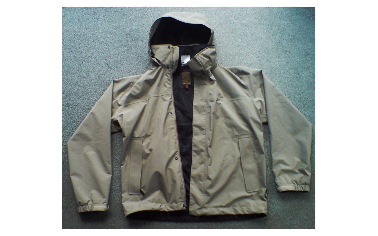Light zip jacket with an unfolded hood laid flat.