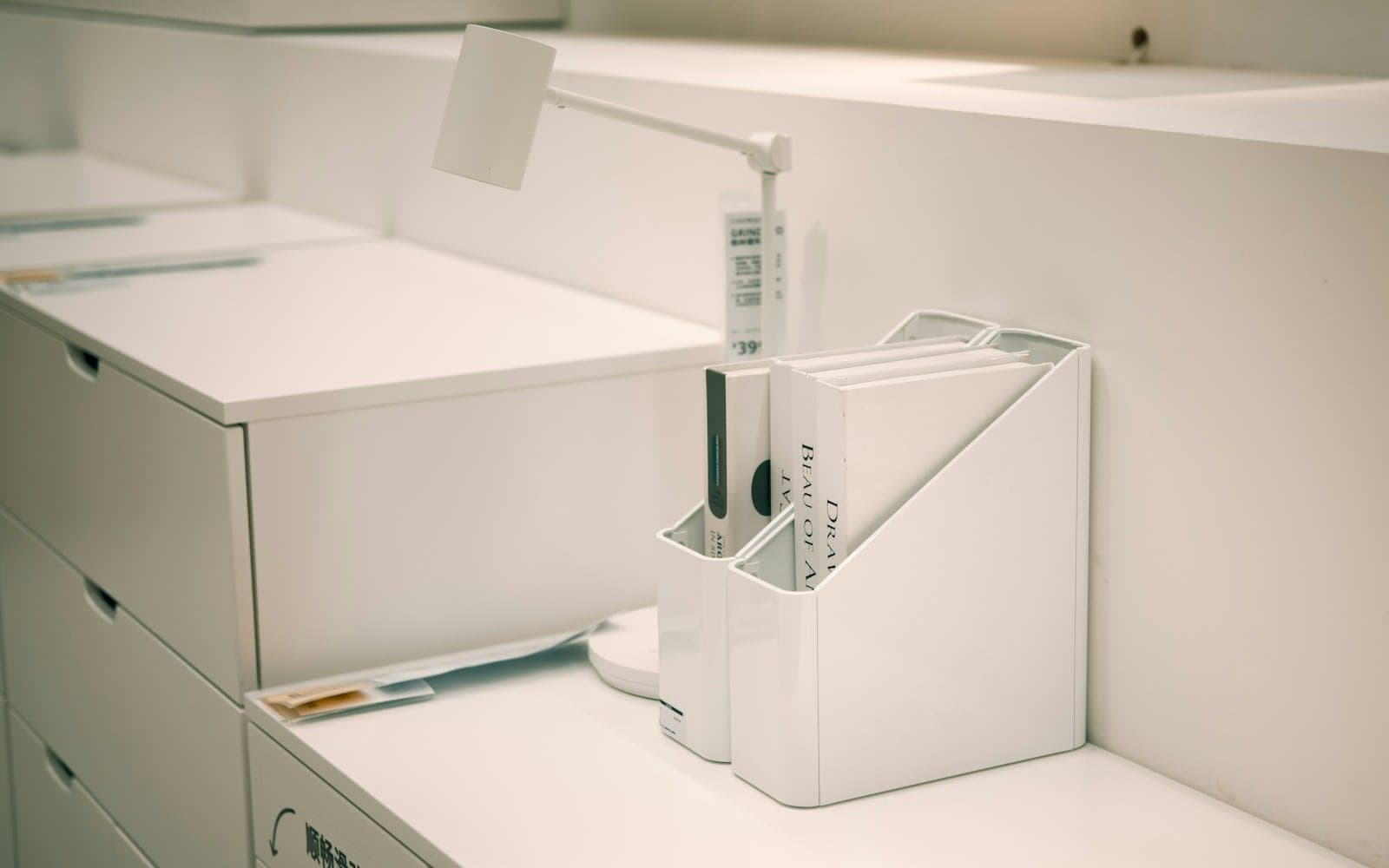 White office organizer with files on desk