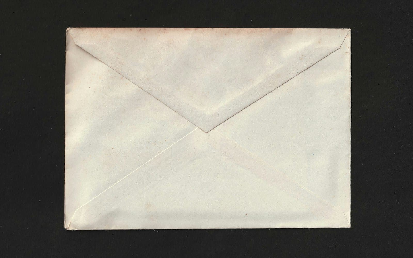 Plain paper mailing envelope shown from the flap side.