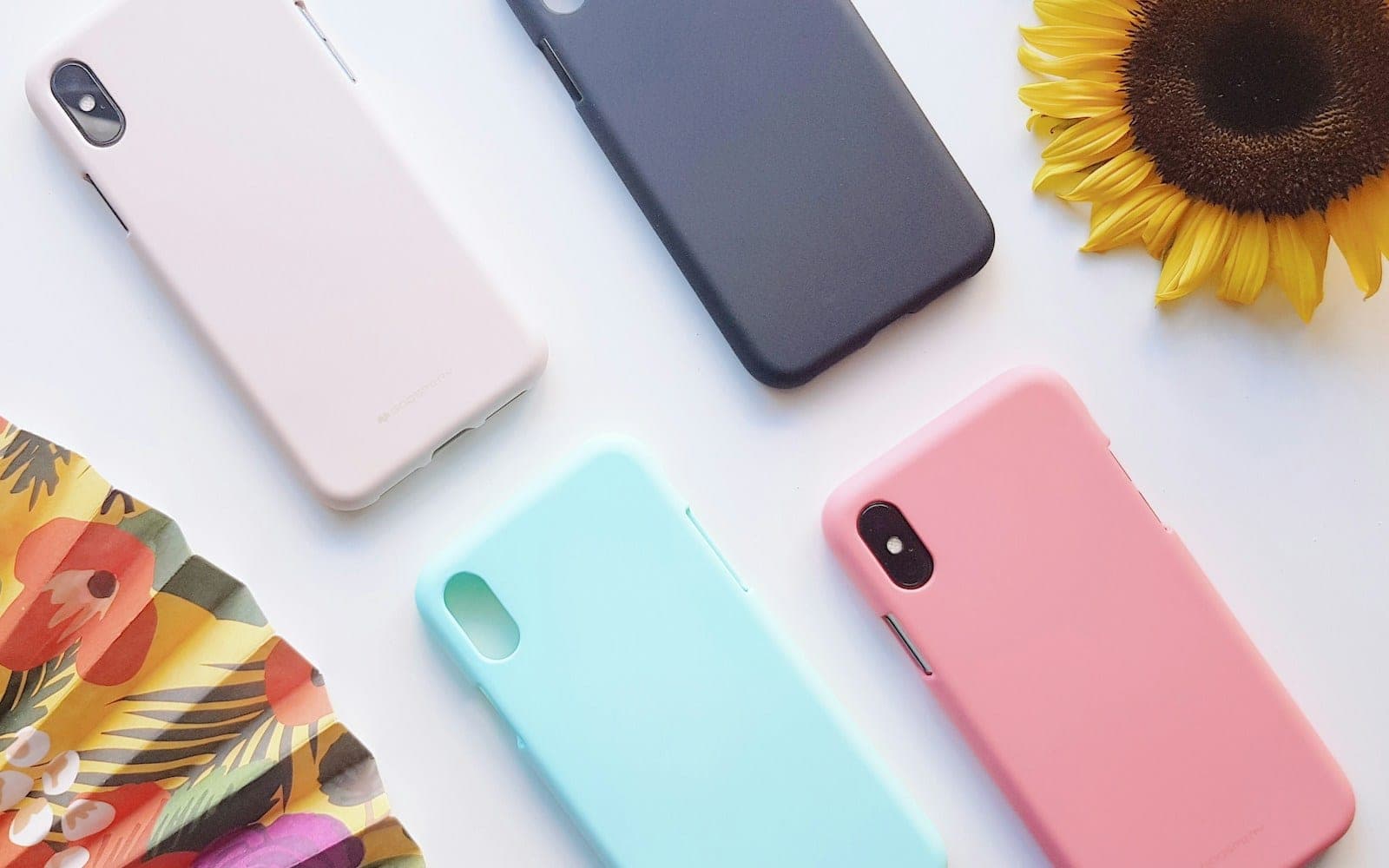 four assorted-color iPhone X cases