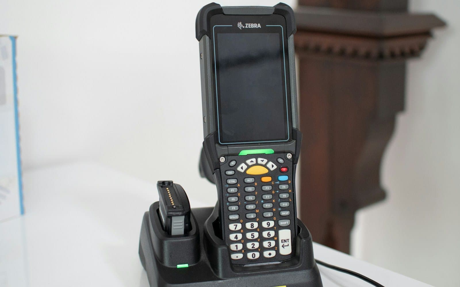 Barcode scanner device in charging dock on table