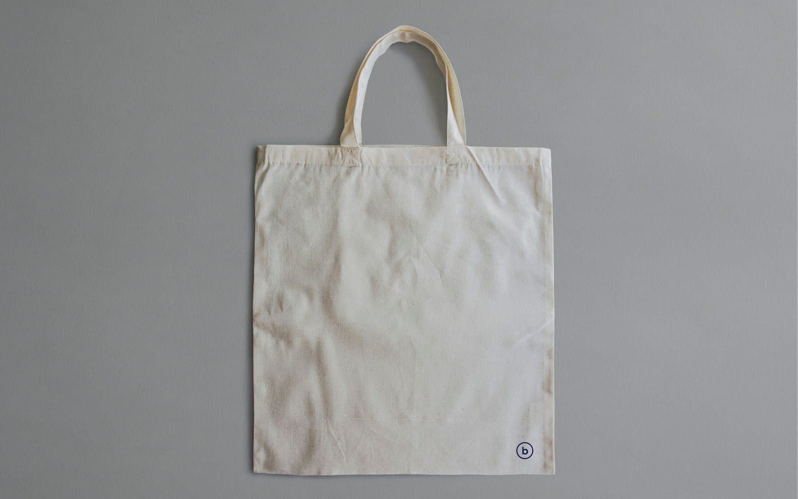 white reusable bag on gray surface
