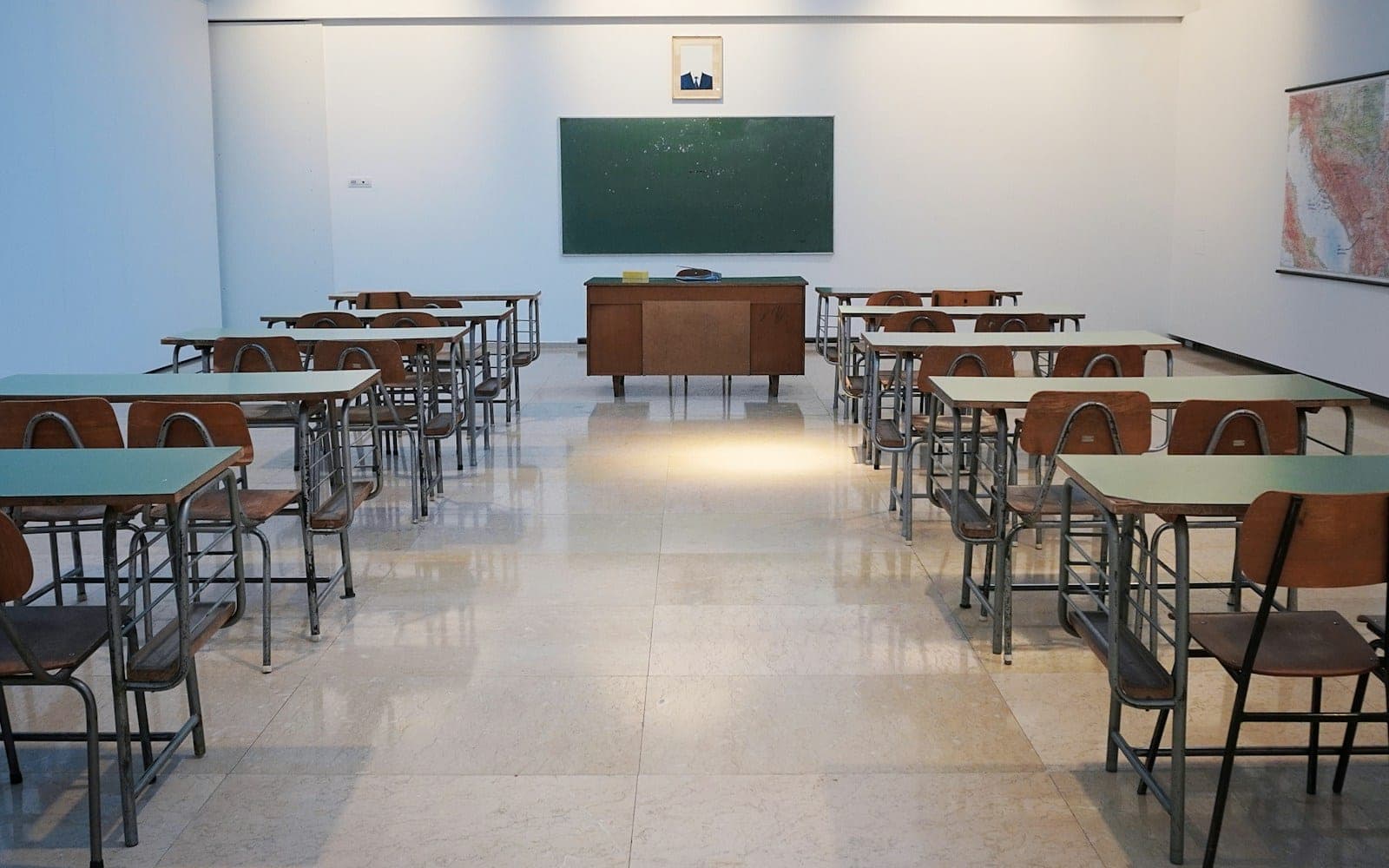 empty classroom with desks and chalkboard